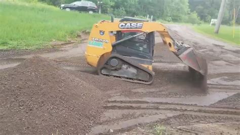 grading dirt with skid steer|grading driveway with skid steer.